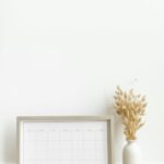 organizing calendar and vase on a table